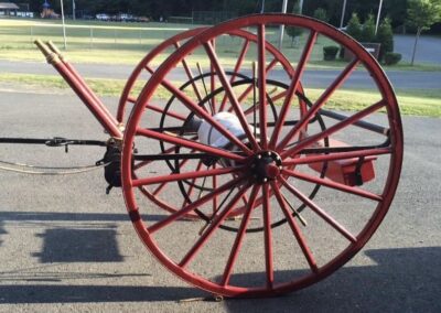 Hand-drawn fire hose reel wagon